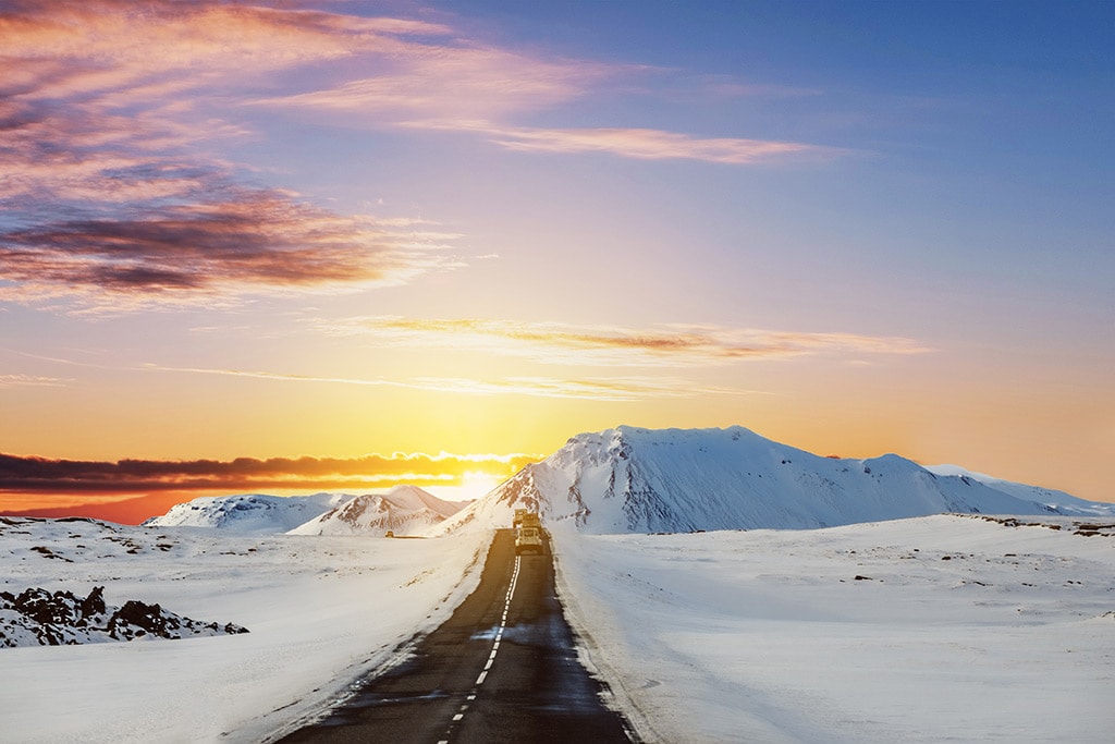 Colorful sunset on the road in winter