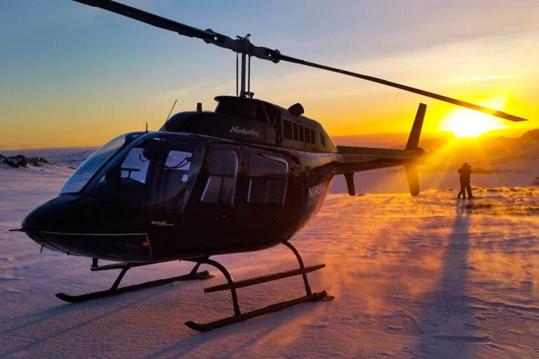 Iceland fire and ice helicopter tour wintry landscape sunset