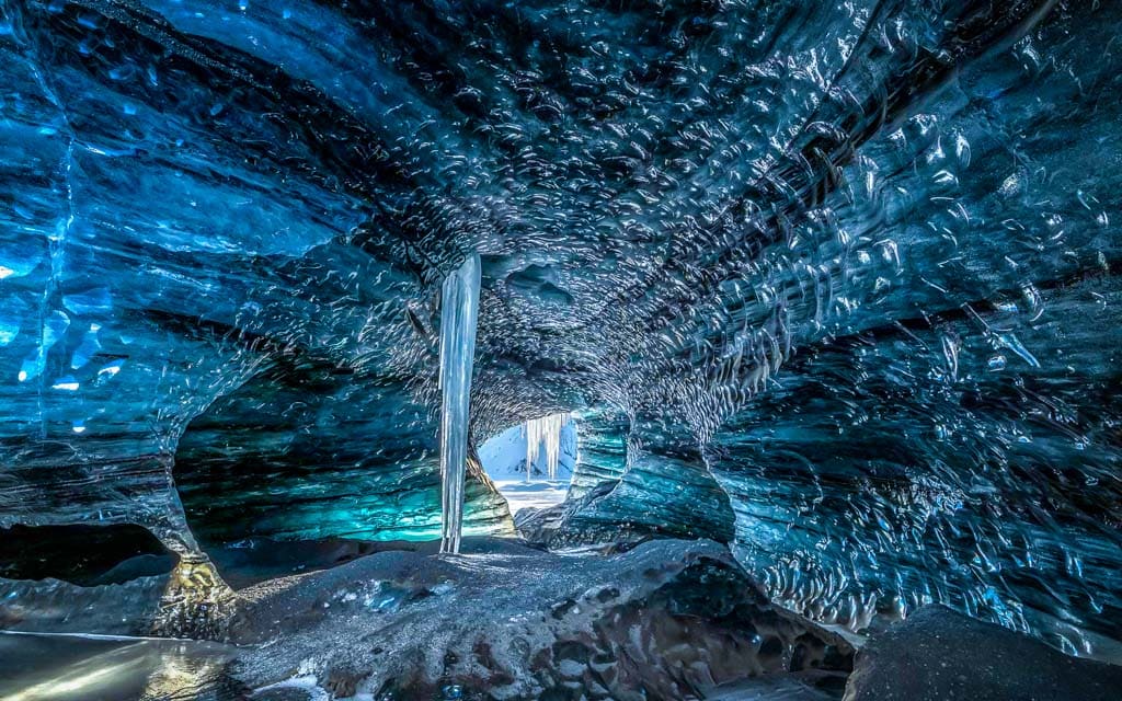 Blue ice cave with Ice waterfall