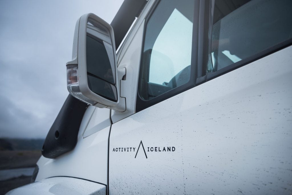 Logo of 'Activity Iceland' displayed on a white monster truck.