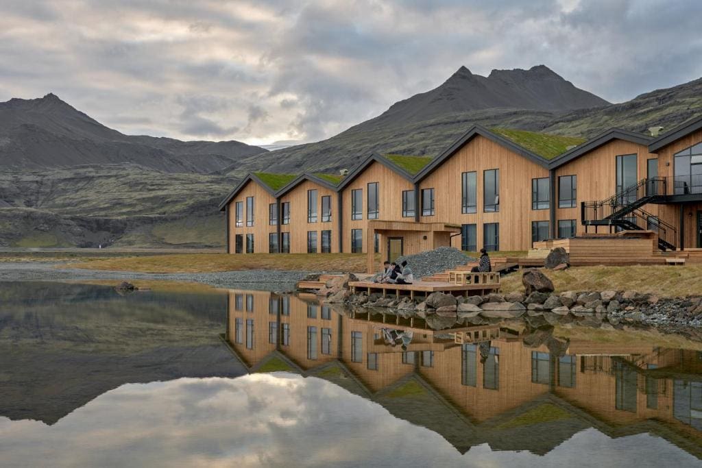 Reflective lake with yellow lodge