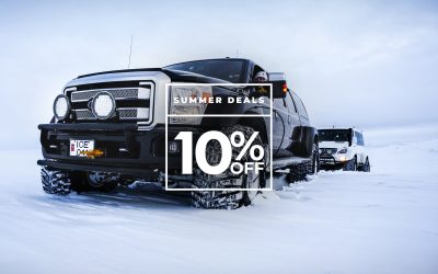 Off-road vehicle navigating through snowy Icelandic terrain, promoting summer deals with up to 10% off on selected tours.