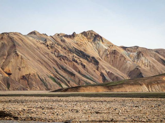 Rugged, multicolored hills in the Iceland Highlands on a Landmannalaugar tour.