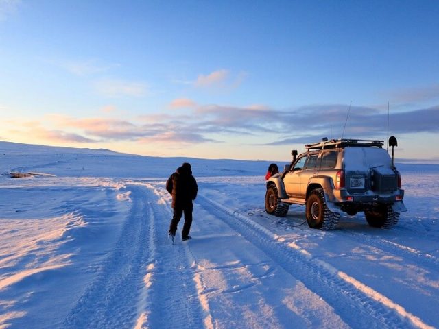 Super Jeep driving through West Iceland’s rugged terrain in winter