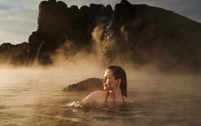 Woman bathing in the geothermal water at Sky Lagoon Reykjavík