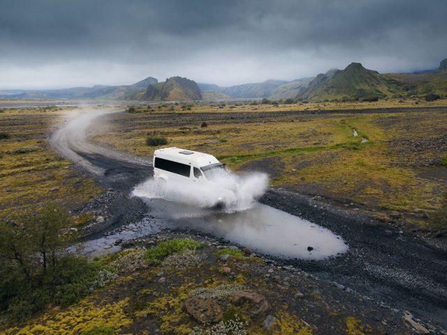 Jeep navigating a rugged trail in the mountainous terrain of Thórsmörk.