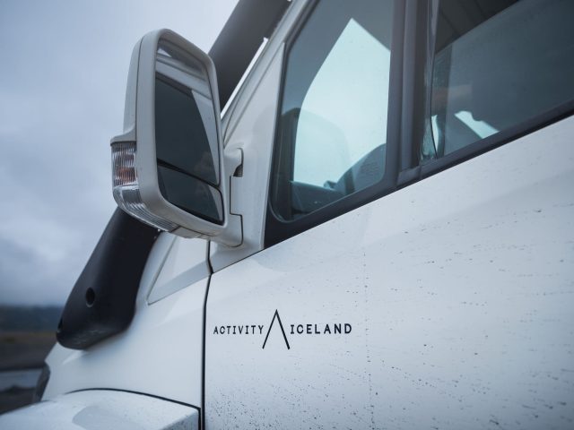 Logo of 'Activity Iceland' displayed on a white monster truck.